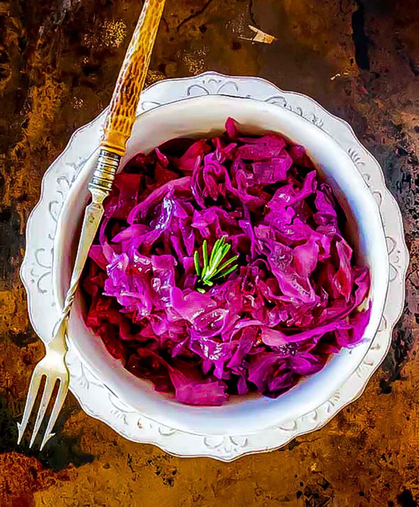 braised red cabbage with apples in a bowl