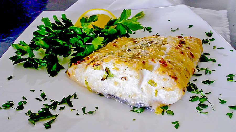 fillet of baked halibut on a plate