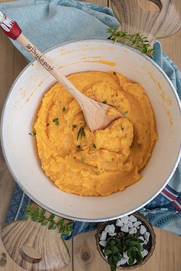 sweet potato and yam mash in a bowl, holiday dinner side dish