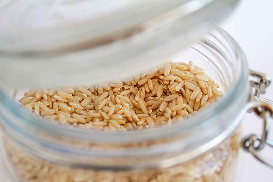 uncooked brown rice in a jar