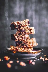 5 stacked gluten free protein bars on a plate
