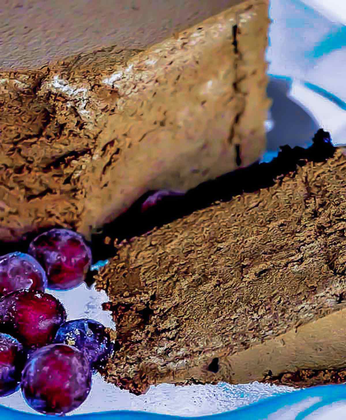 slice of chocolate mousse cake garnished with frozen grapes