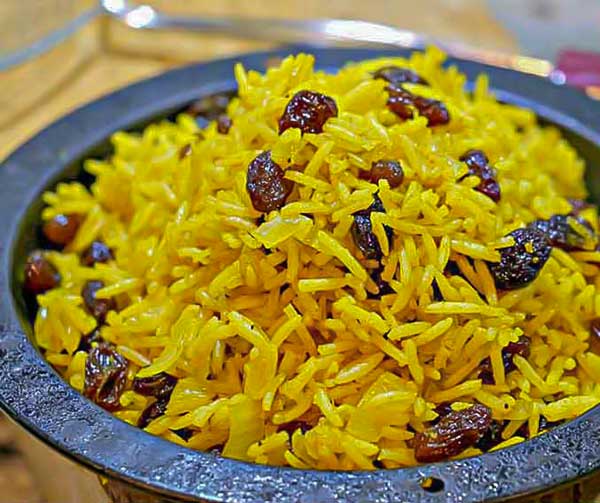 spiced rice with raising in a cast iron bowl