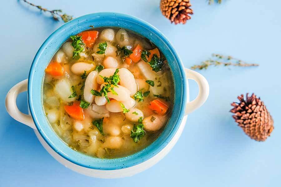 vegan white bean soup in a mug