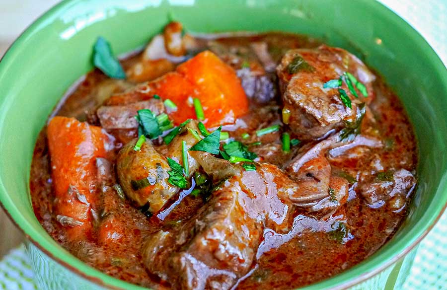 close up of beef bourguignonne in a bowl