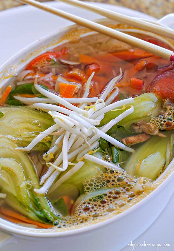 BOK CHOY SOUP IN A BOWL WITH CHOPSTICKS