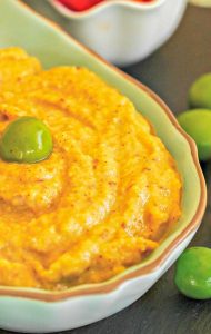 eggplant dip with an olive in a bowl