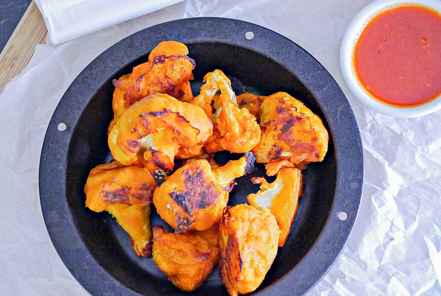 cauliflower buffalo tidbits on a plate for game day