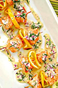 salmon pops on a skewer dill sauce