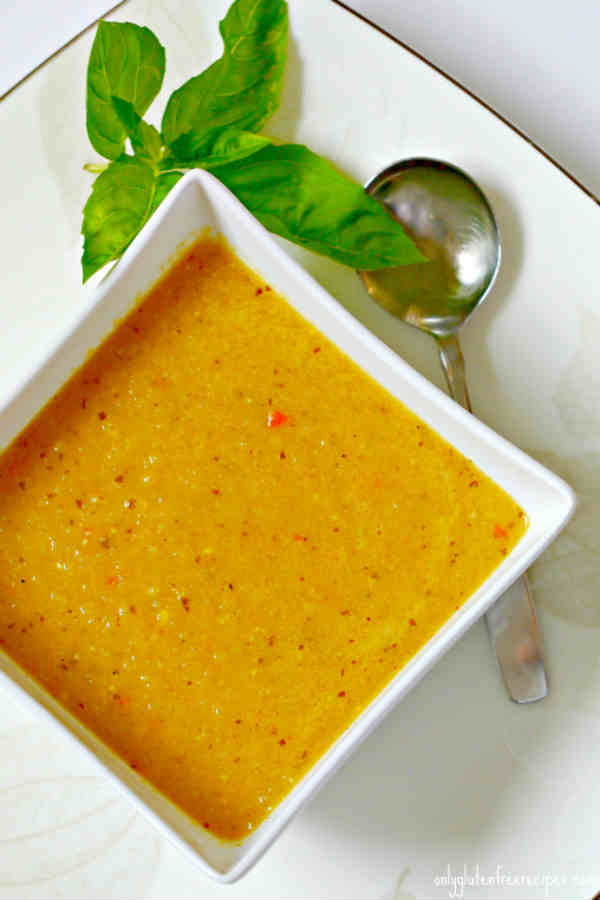 zucchini coconut soup in a square bowl