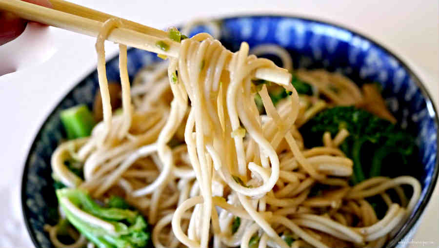 garlic noodles in a dish with chopsticks