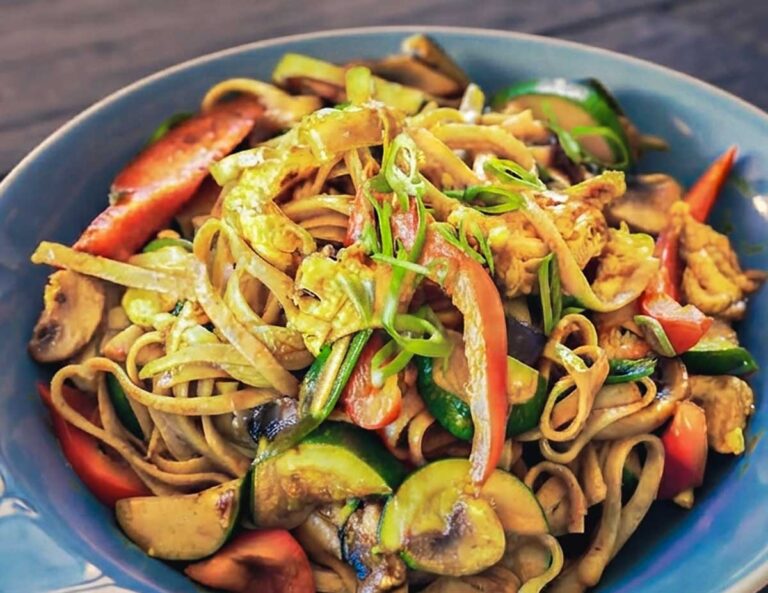 20-minutes singapore style noodles stir-fried with curry sauce and veggies in a bowl