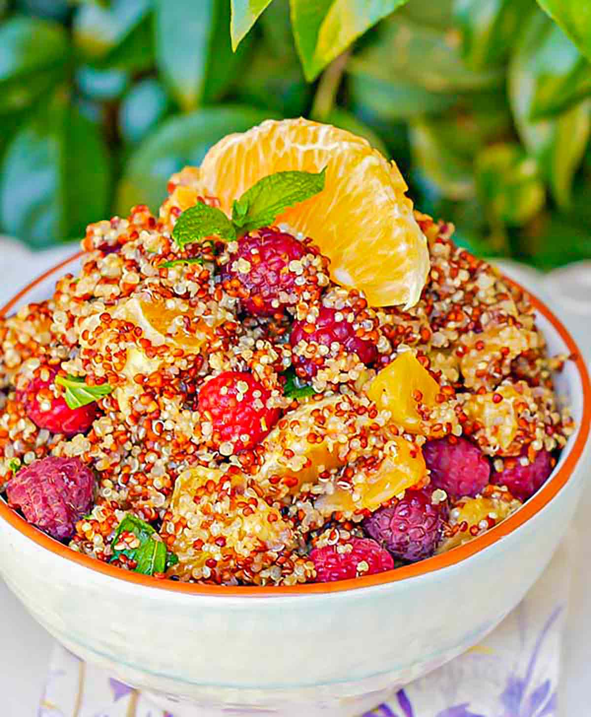 fruit, quinoa, and pecans in a bowl