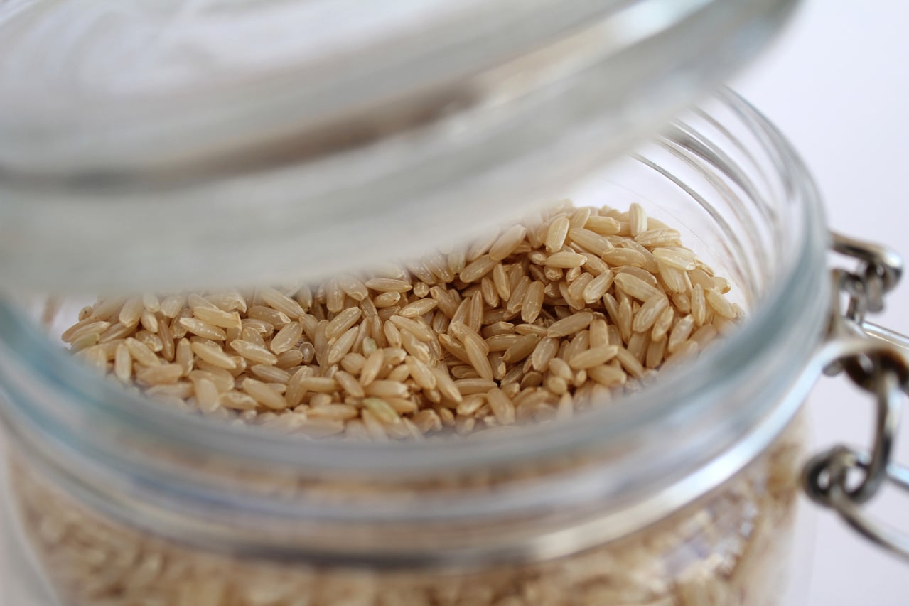 dry brown rice in a mason jar with lid slightly open