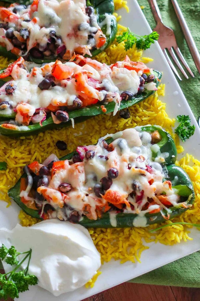 roasted poblano peppers with beans, onions, tomatoes and cheese