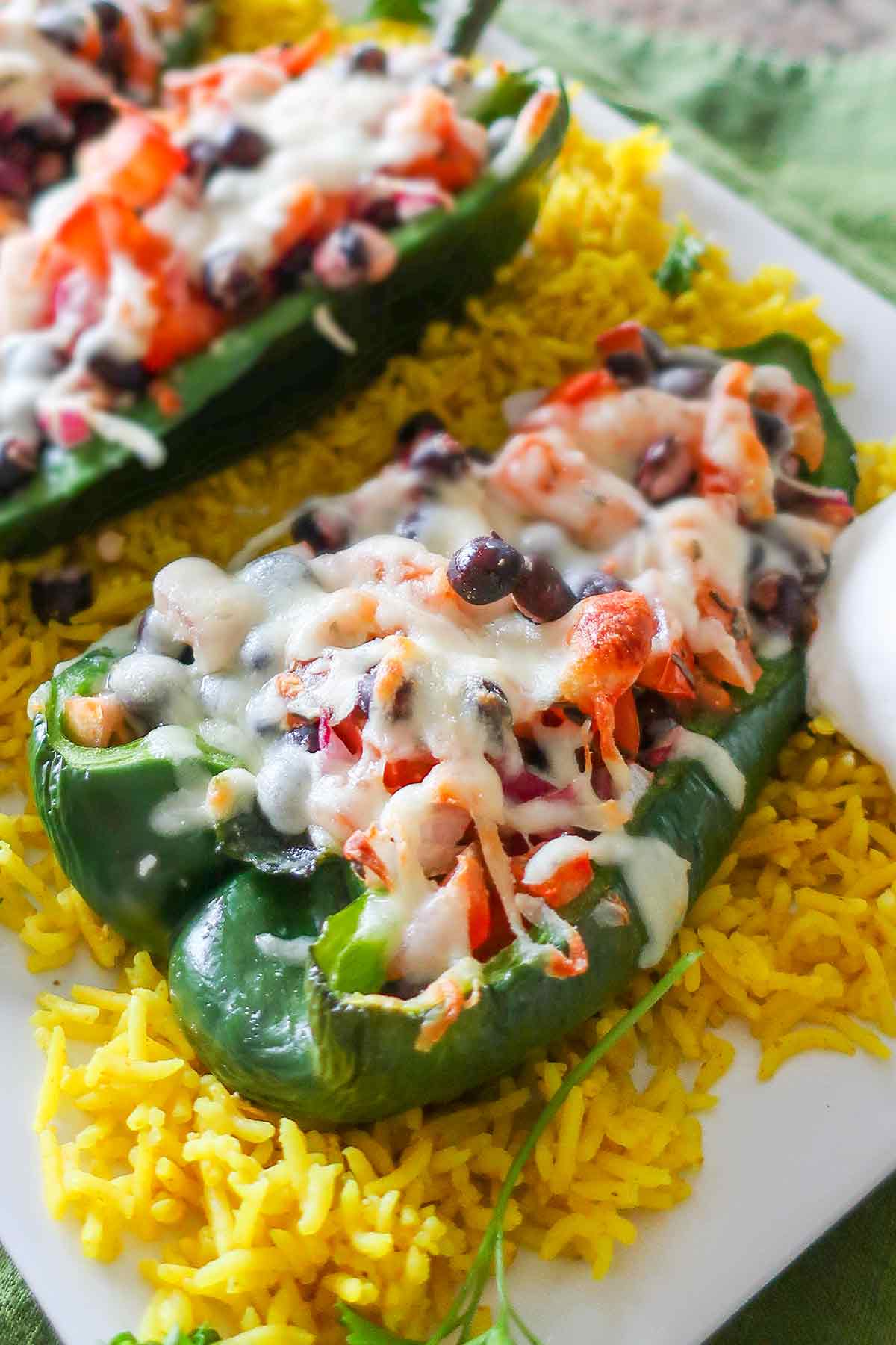 close up of roasted stuffed poblano peppers