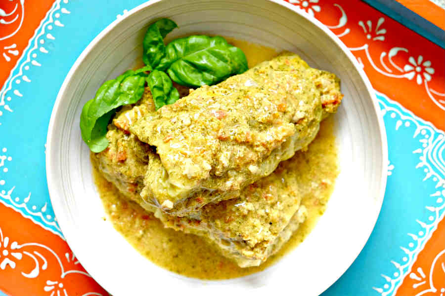 stuffed Savoy cabbage rolls in a bowl with curry.sauce