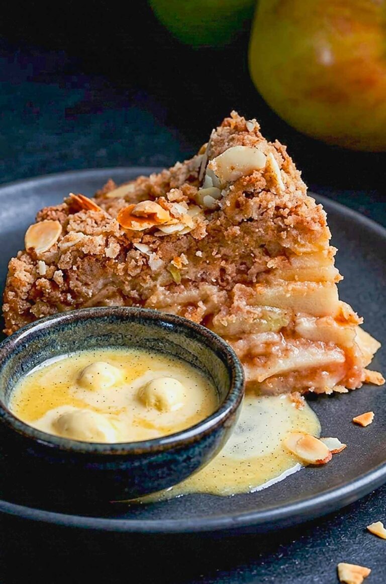 Close up of a slice of Crustless Gluten-Free Apple Pie with a melted vanilla ice cream in a bowl on the side