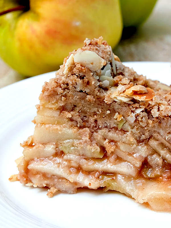 a slice of crust free apple pie on a plate