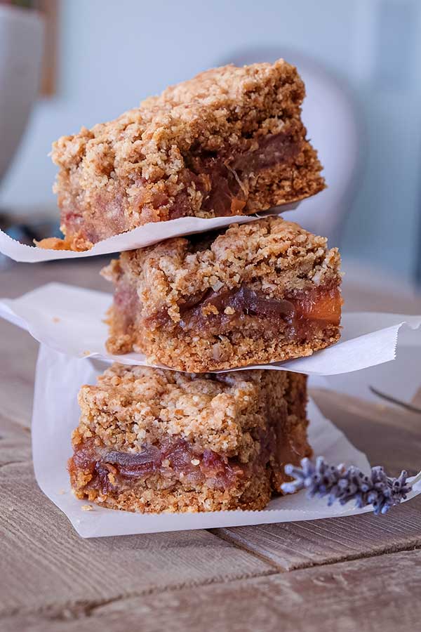 3 gluten free date bars stacked on top of each other