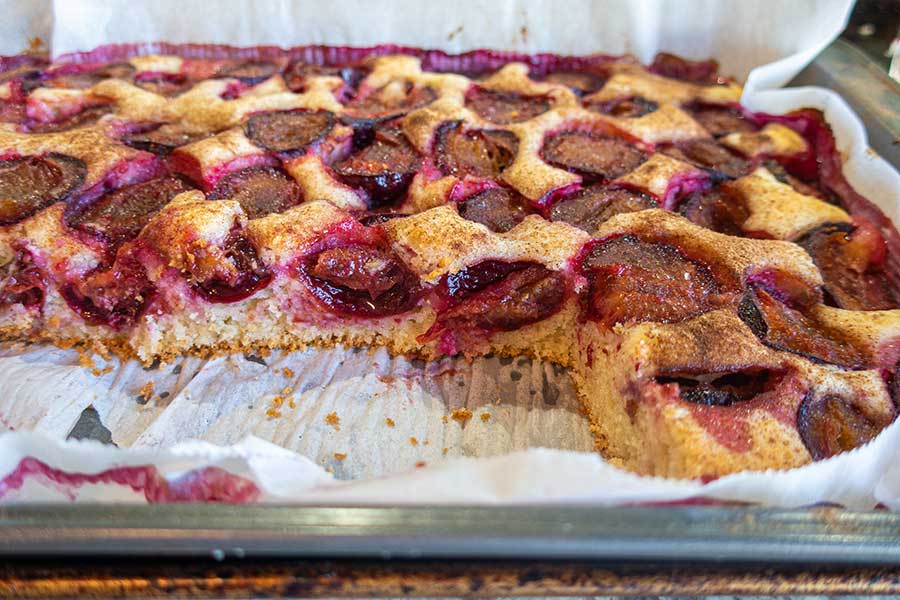 close up of sliced grain free plum cake