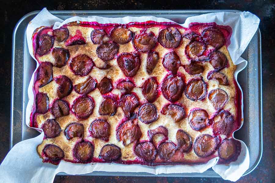 top view of summer plum cake in a pan