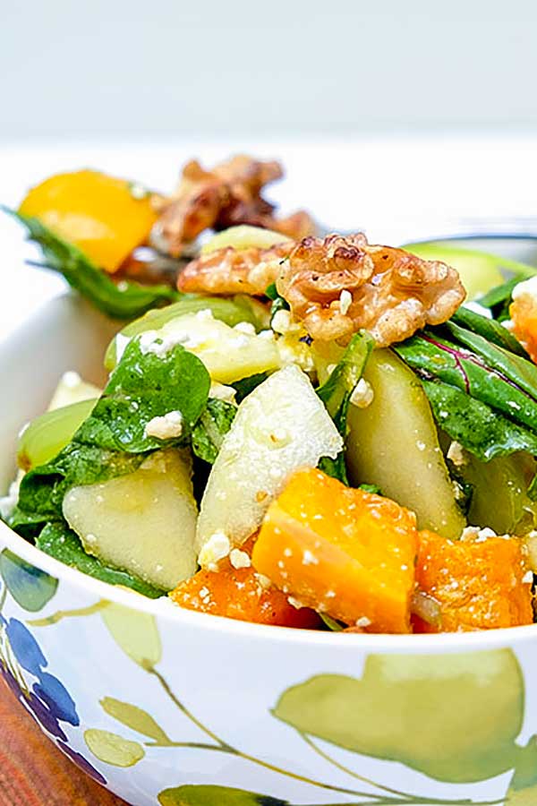 close up of butternut squash salad in a bowl