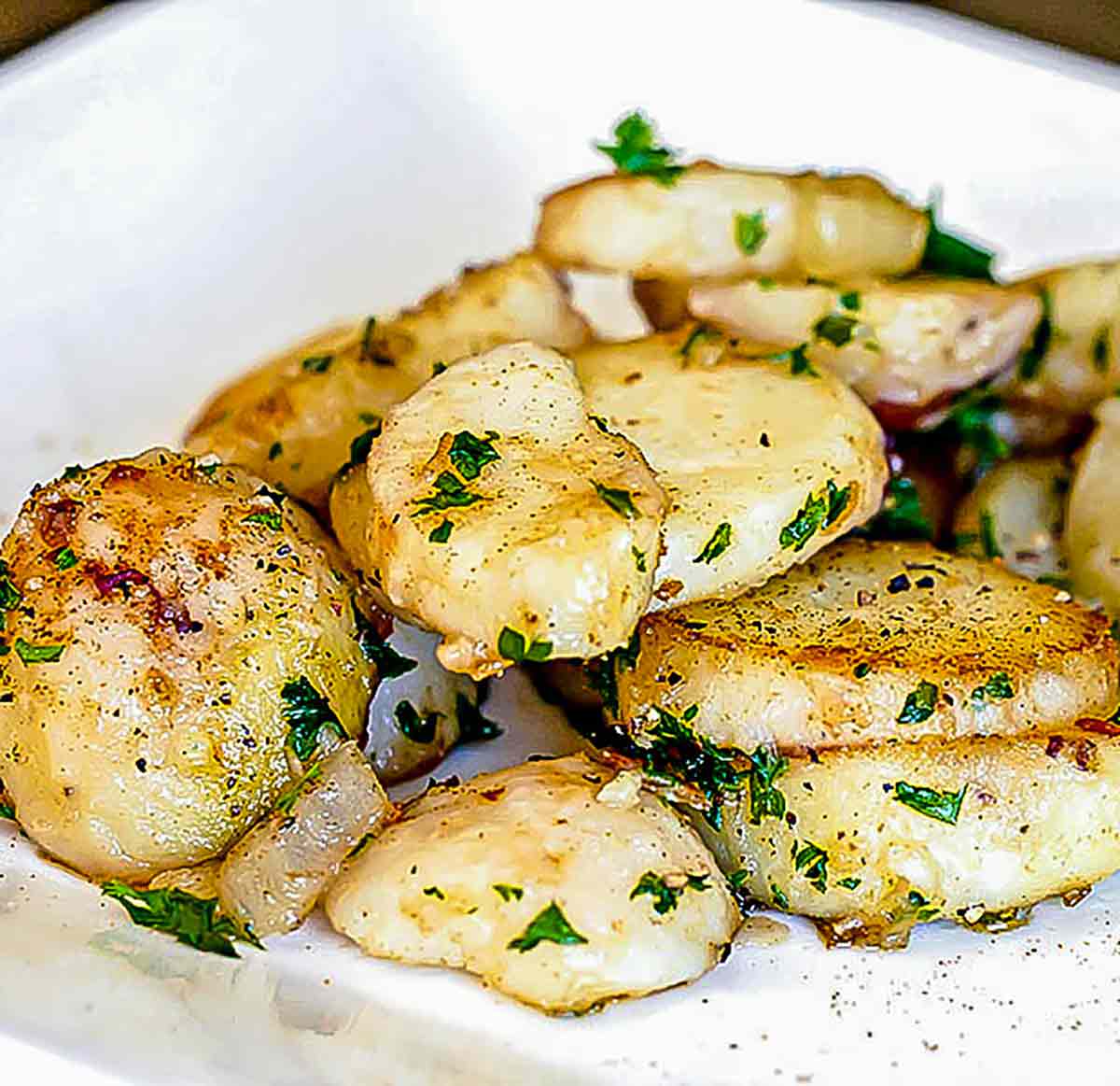 close up of cooked potatoes with parsley