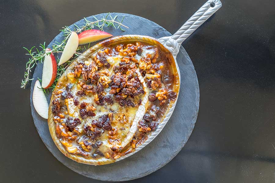 hot camembert dip appetizer in a skillet