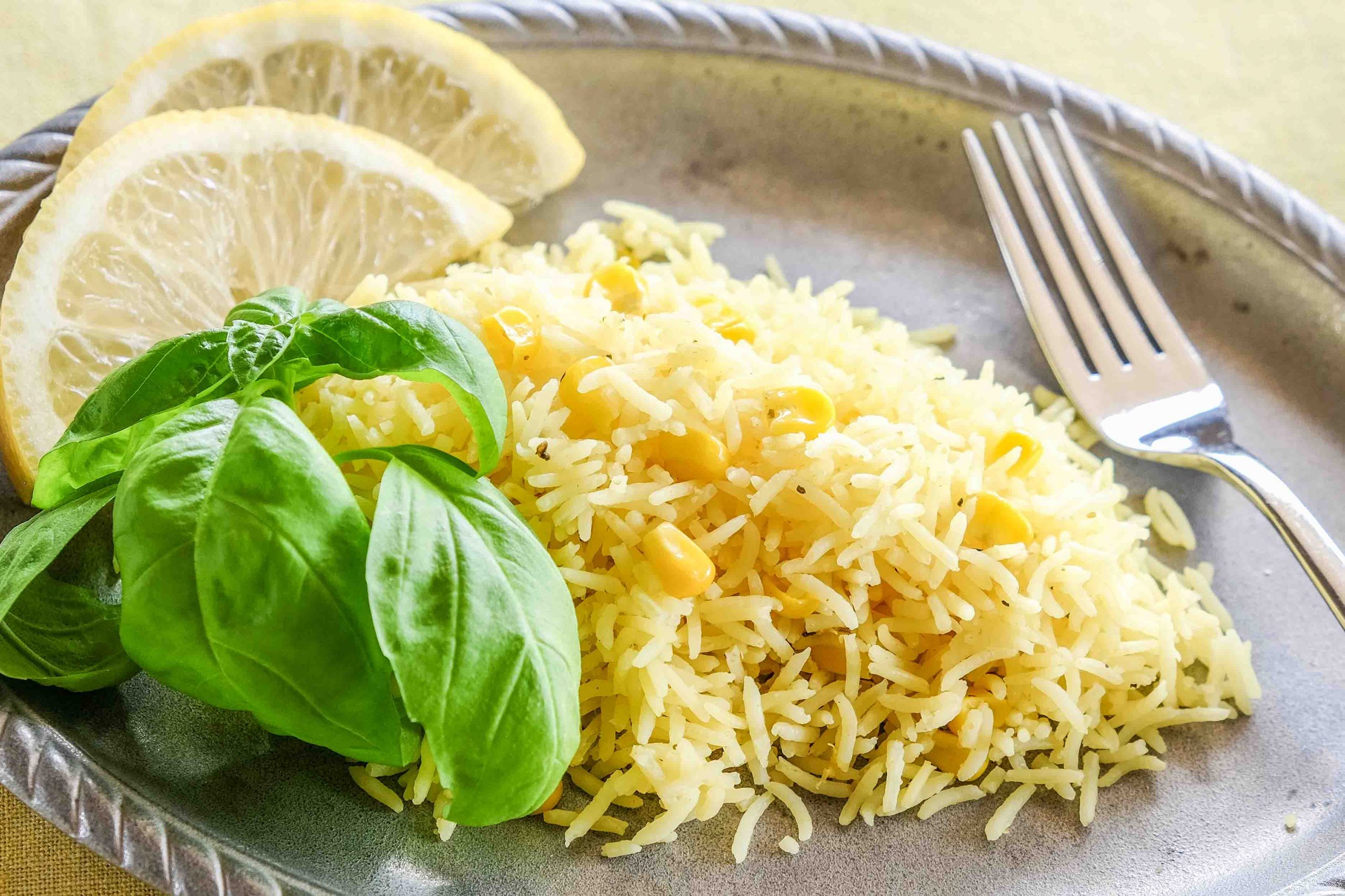 indian lemon rice on a plate with basil