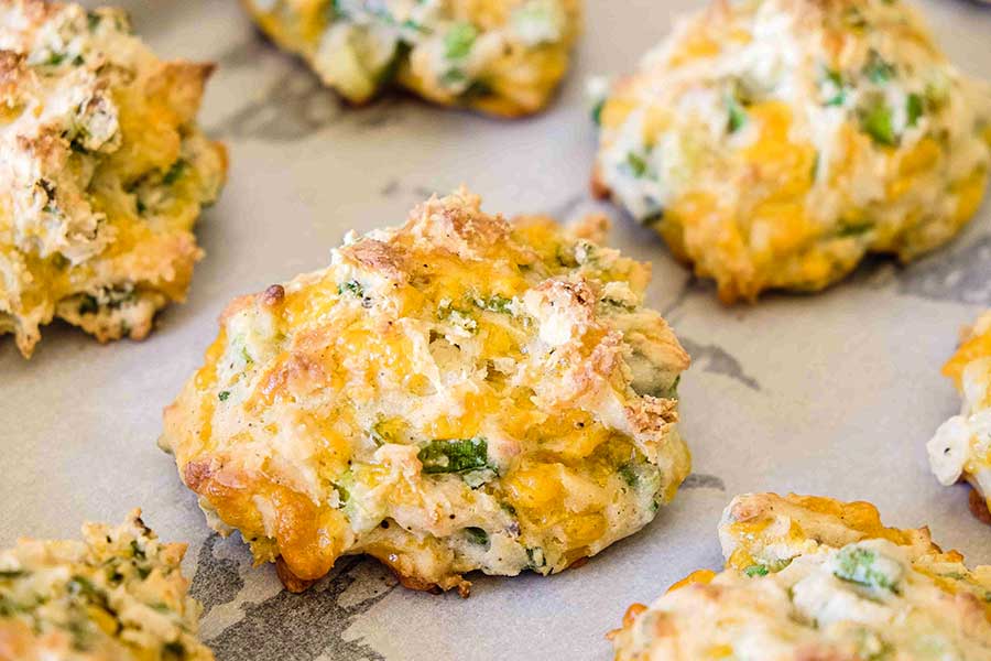 gluten free cheesy scones on parchment paper