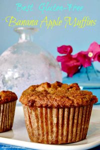 close up of gluten and grain free banana muffin on a white plate