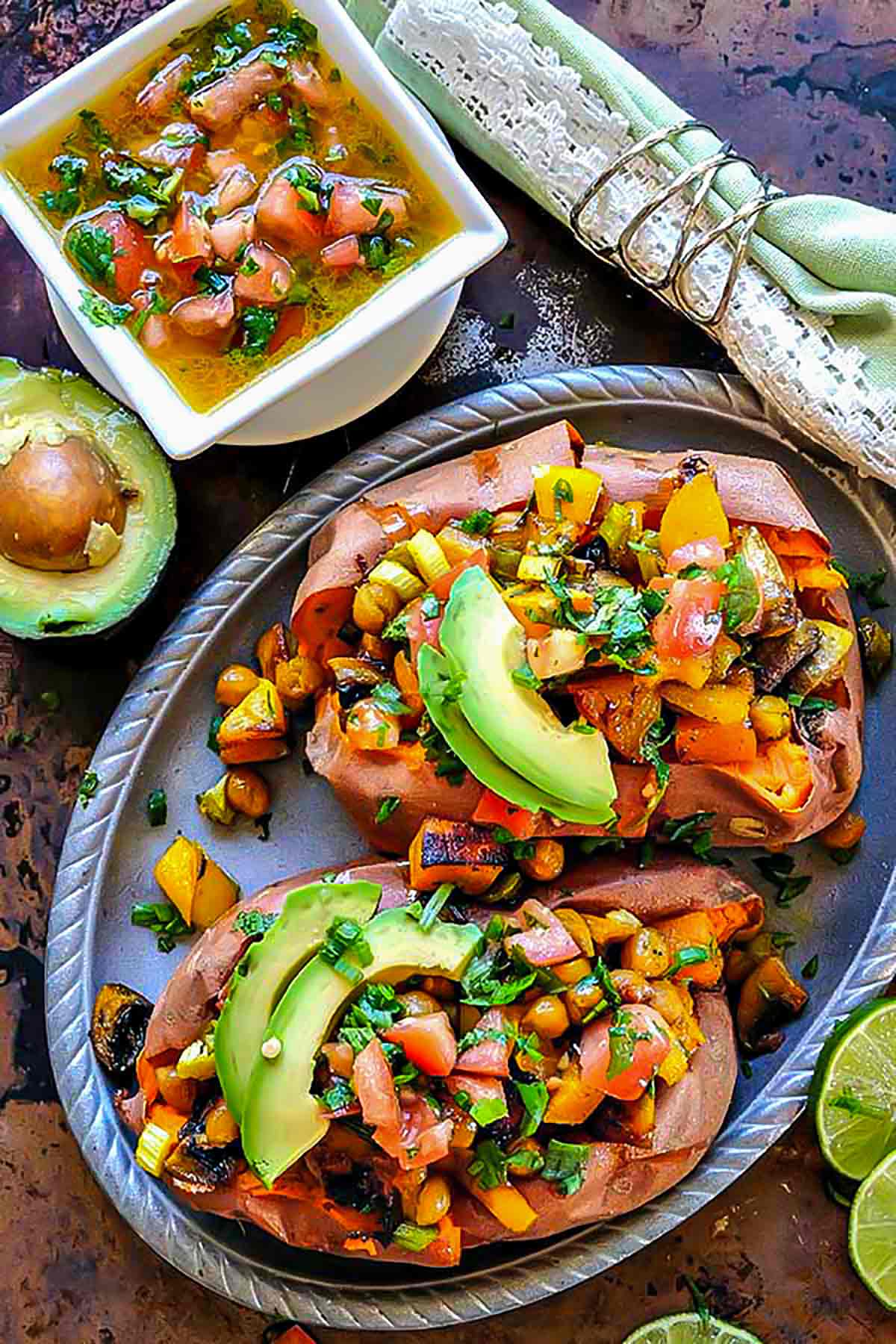 overview of baked stuffed yams with veggies and topped with salsa
