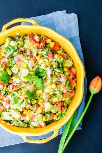 avocado and corn salsa in a large yellow bowl