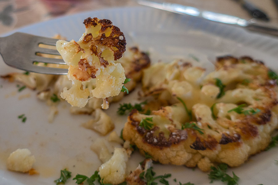 piece of cooked cauliflower steak on a fork