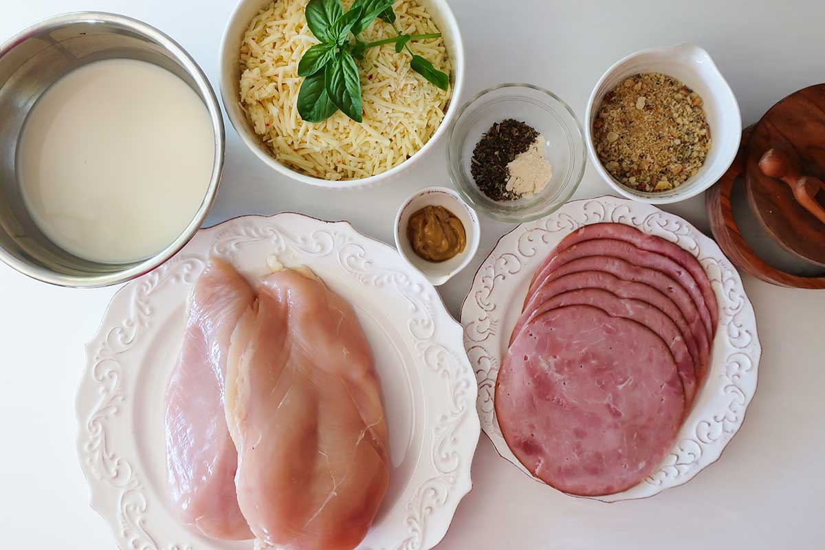 ingredients for chicken cordon bleu casserole chicken, ham, cheese, spices, cream, breadcrumbs