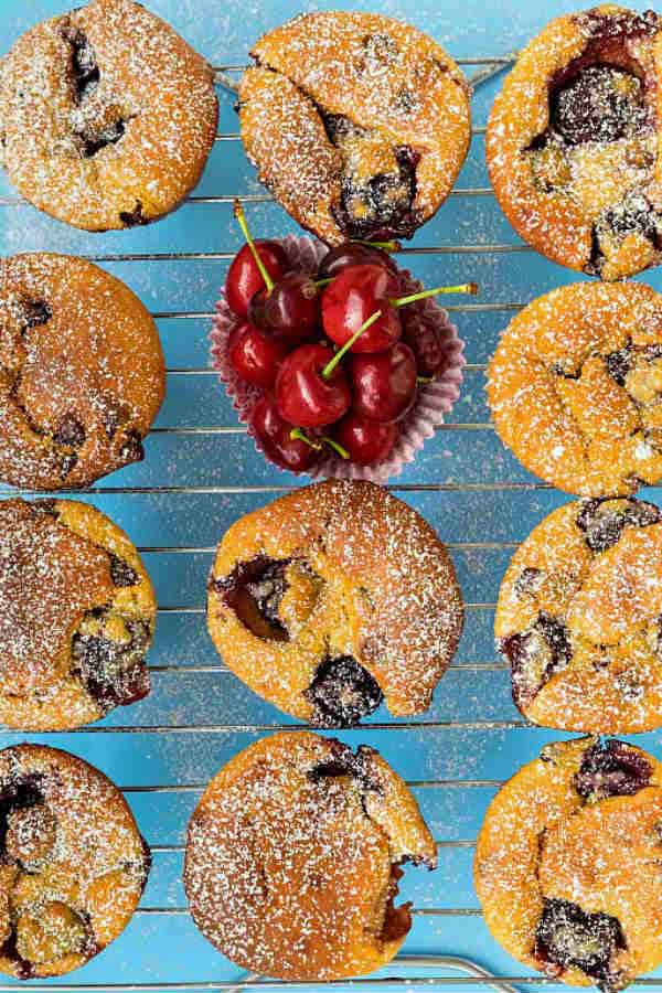 gluten free cherry chocolate chip muffins on a cooling rack