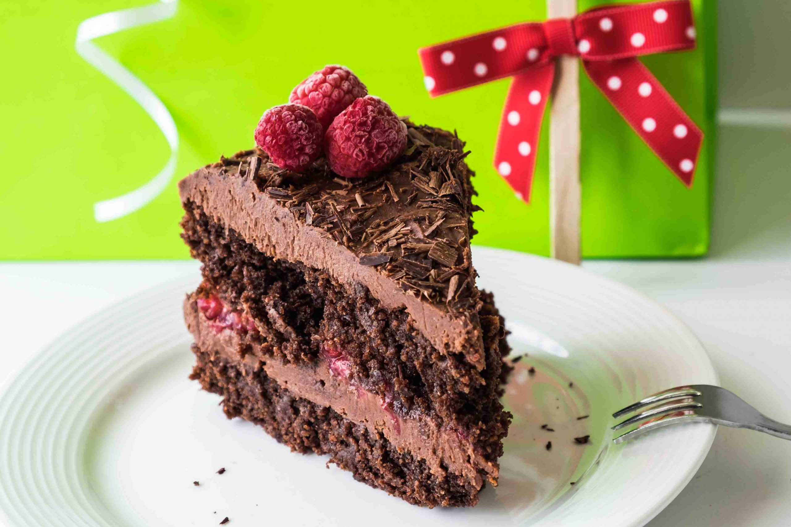 a slice of gluten free vegan chocolate cake on a plate