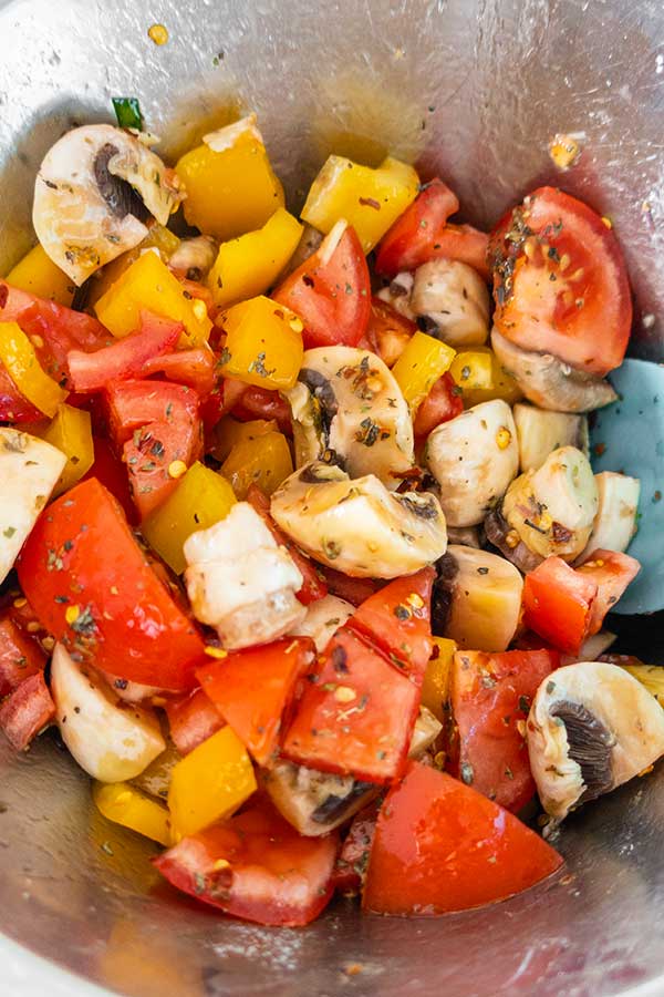 chopped veggies with herbs in a bowl