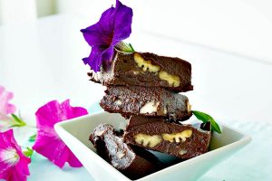 Stacked 4 ingredient chocolate fudge squares on a plate