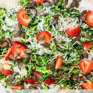 Kale Caesar Salad with Strawberries and Pumpkin Seeds