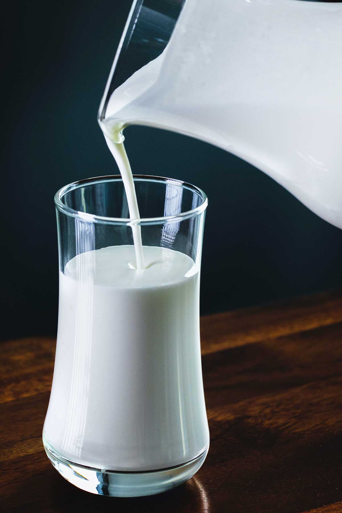 pouring coconut milk into a glass