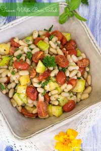 white bean salad with tomatoes in a bowl, vegan.