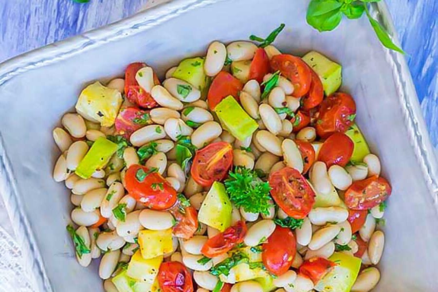 tuscan bean zucchini and tomato salad in a bowl