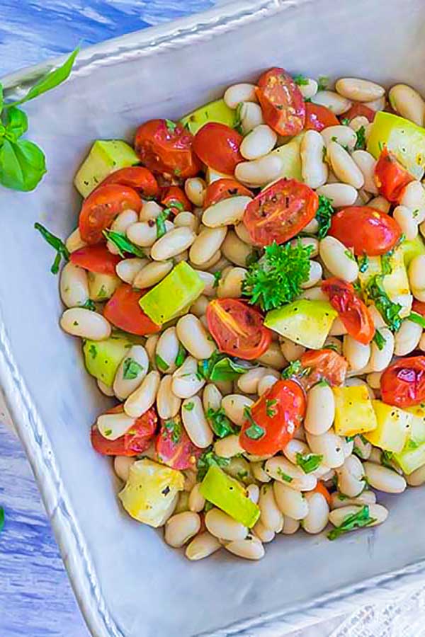 tuscan bean zucchini and tomato salad in a bowl