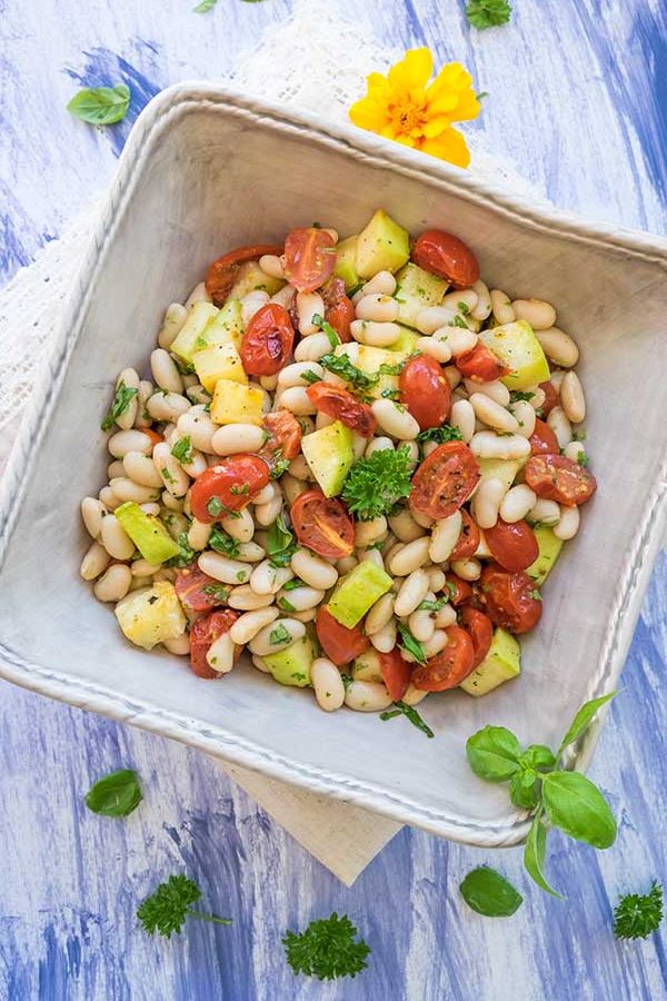 tuscan white bean salad with tomatoes in a bowl, vegan