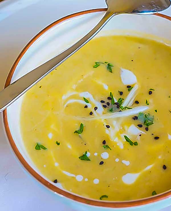 bowl of celeriac soup with a spoon