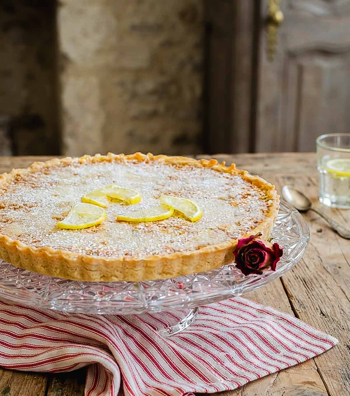 French Lemon Tart with Flaky Gluten-Free Pastry topped with lemon slices