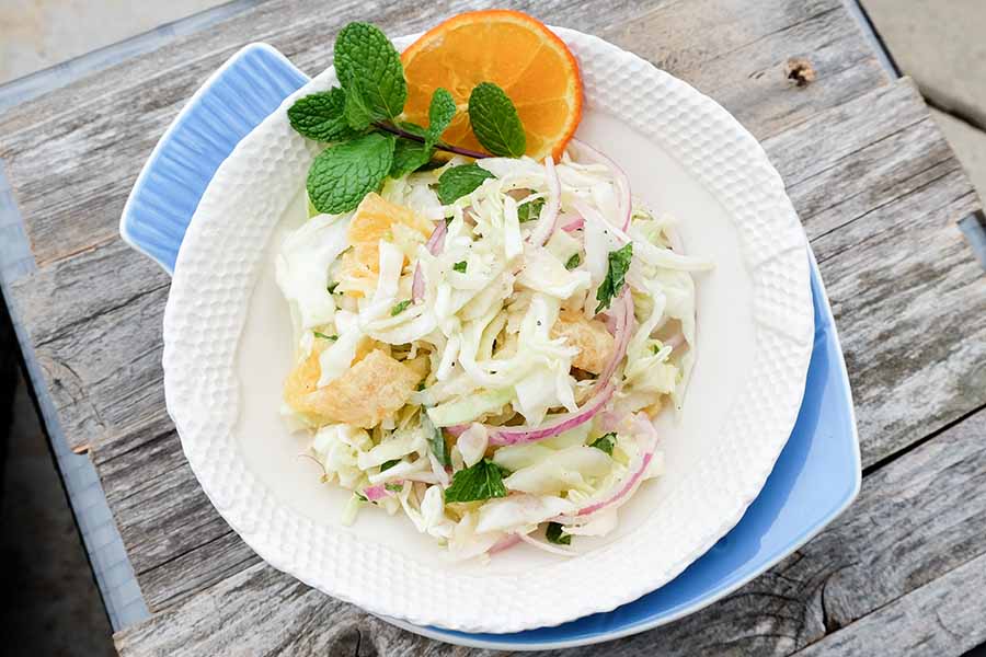 cabbage, fennel, salad with fruit in a bowl