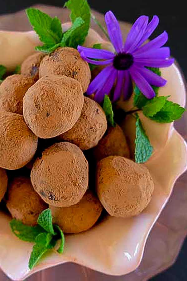 tropical chocolate rum balls in a bowl